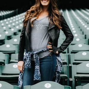 Baseball wifey t-shirt in grey with black leather jacket and flannel tied around waist